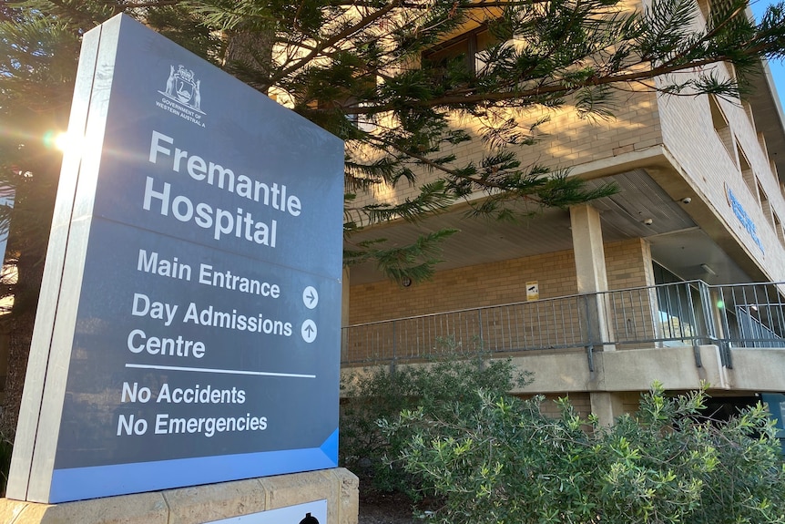 A sign outside Fremantle Hospital with directions for different departments.