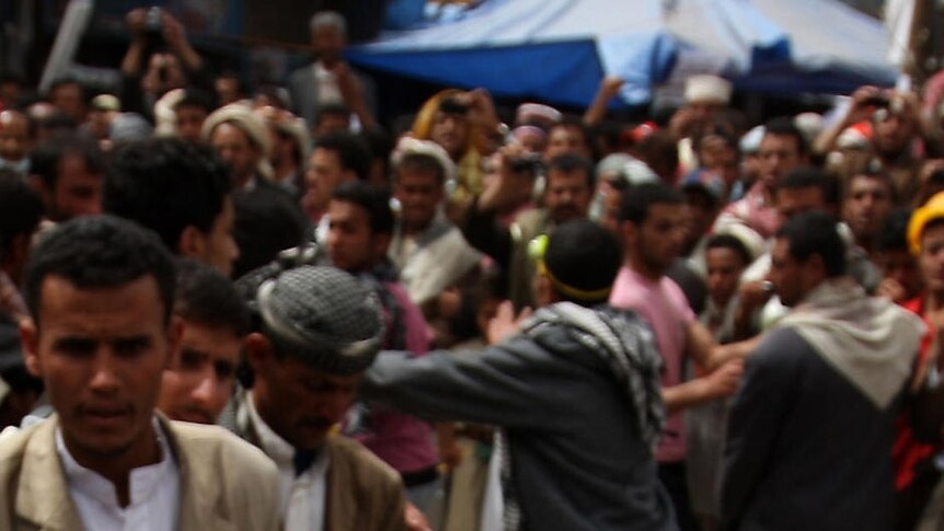 A wounded anti-government protester is carried away in Yemen