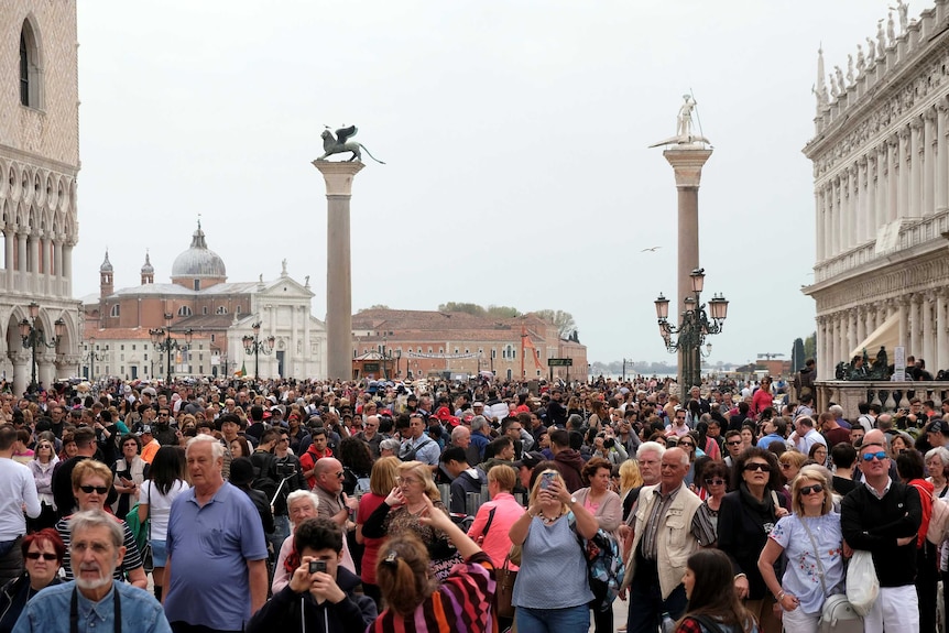 Tourists are seen at St Mark's Square in Venice, Italy.