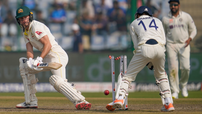 Matt Kuhnemann looks back as the bails fall off the stumps