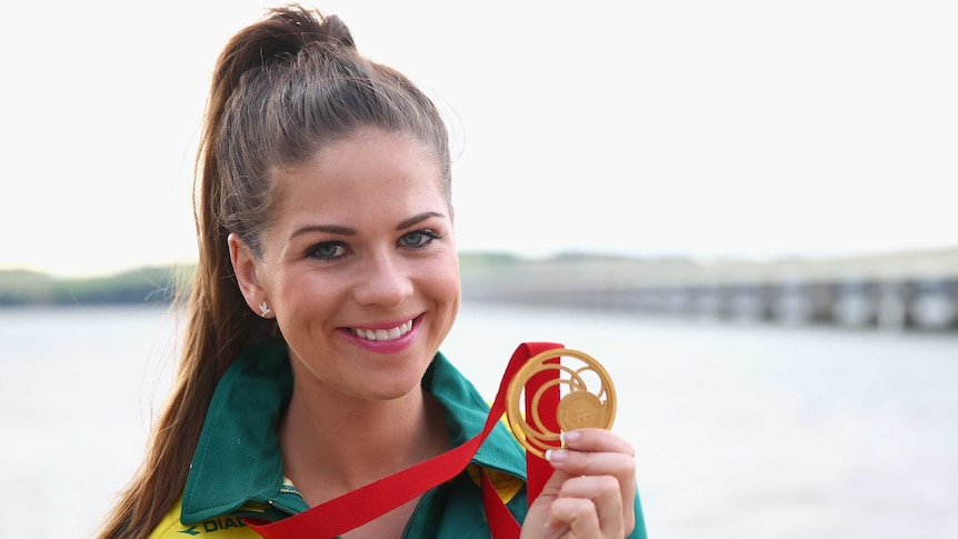 Medal prospect ... Laetisha Scanlan shows off the Commonwealth Games gold she won in 2014