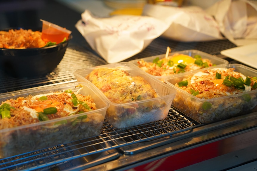 Plastic food containers containing Asian food