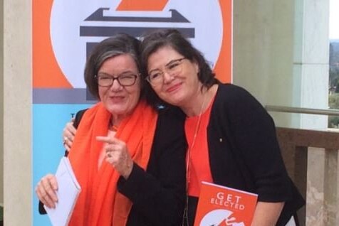 Ruth and Cathy McGowan holding 'get elected' book.