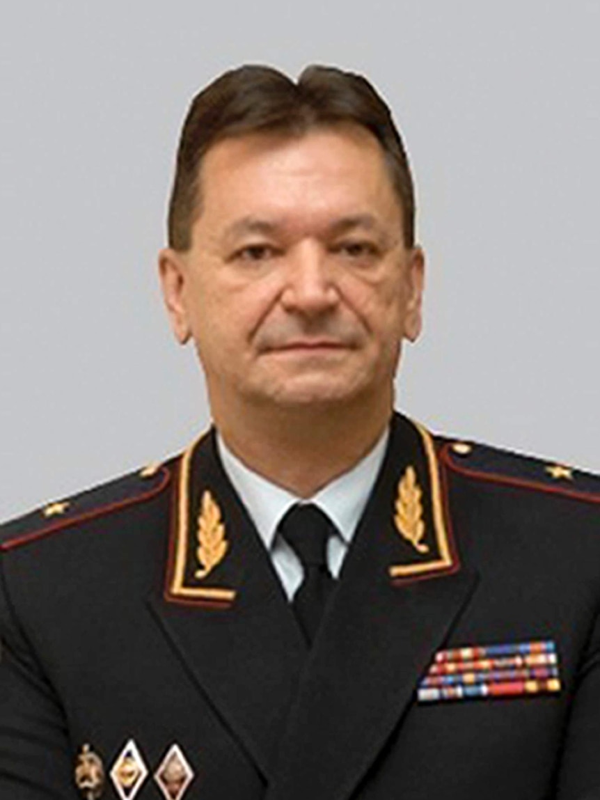 Alexander Prokopchuk wears a neutral expression for an official portrait, wearing his uniform.