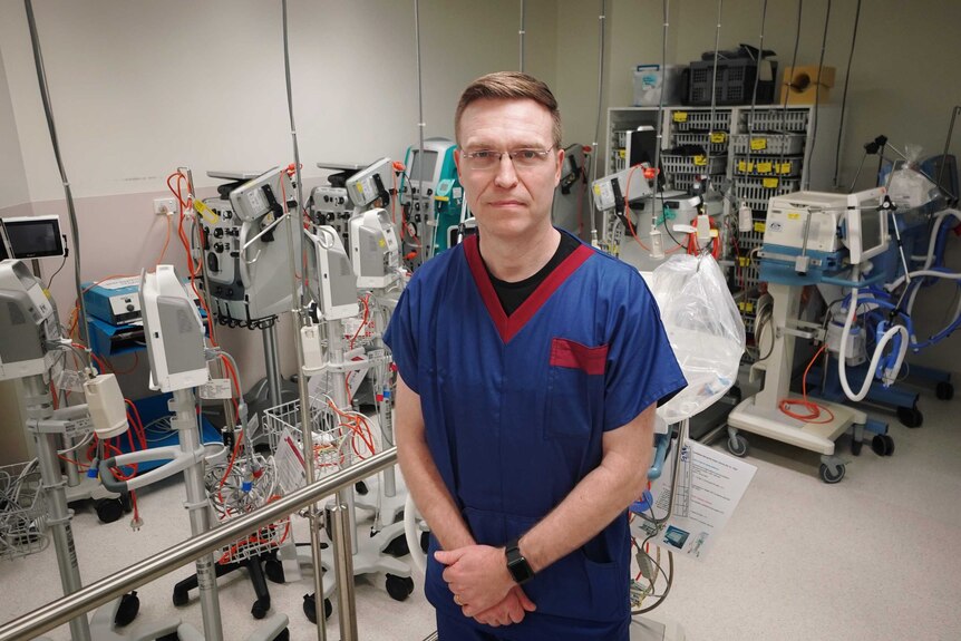 Stephen Warrillow standing among medical equipment in the Intensive Care Unit