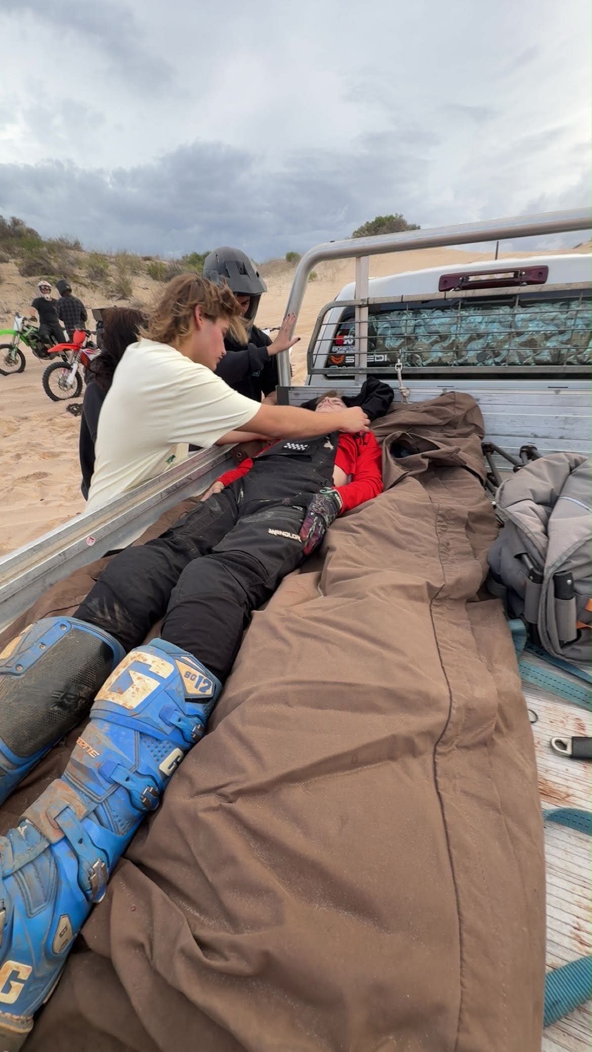 A victim of an accident in the back of a ute. 