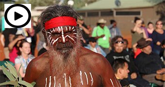 An Indigenous man dancing