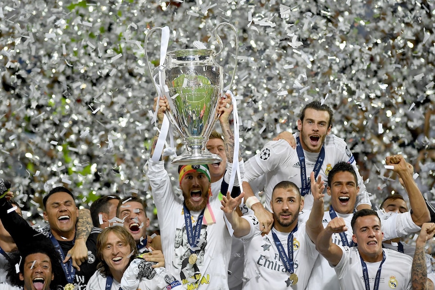 Real Madrid celebrate with Champions League trophy