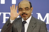 Ethiopian prime minister Meles Zenawi waving as he arrives for a meeting