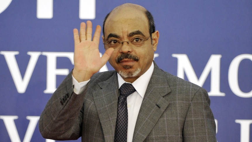 Ethiopian prime minister Meles Zenawi waving as he arrives for a meeting