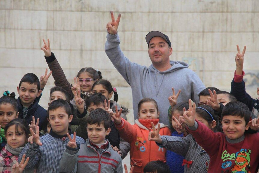 Luke Cornish with a group of Syrian children.