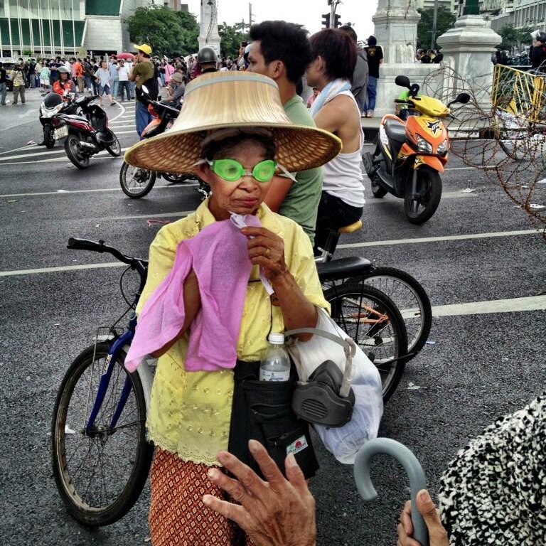 Thai woman dressed for tear gas in Bangkok demonstrations