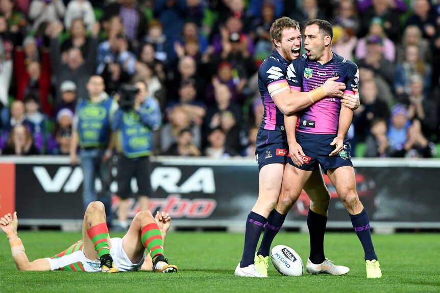 Melbourne Storm's Cameron Smith is congratulated over his try against South Sydney at AAMI Park.