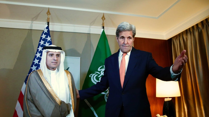 US Secretary of State John Kerry  next to Saudi Foreign Minister Adel al-Jubeir.