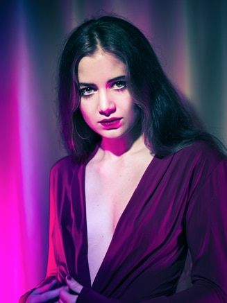 Samira Elagoz wearing a purple dress