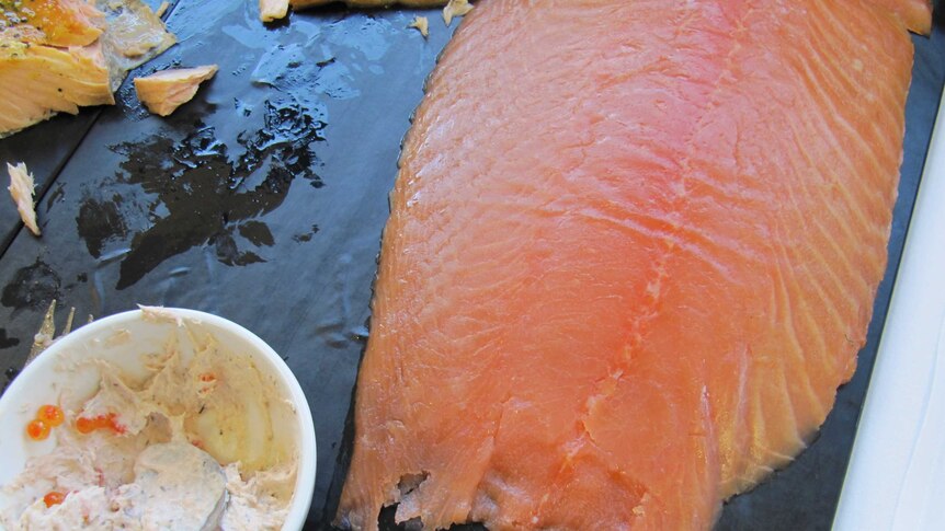 A big slab of smoked salmon and bowl of salmon mousse with salmon caviar