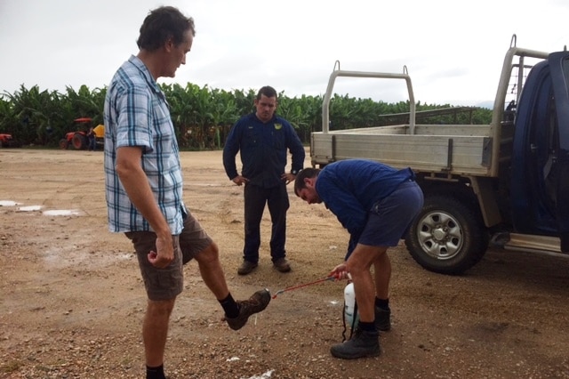 A bloke getting his boots sprayed