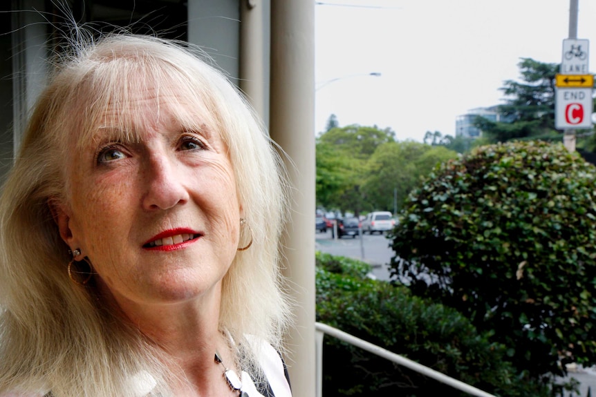 Bionic eye recipient Dianne Ashworth stands on a balcony