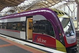 V-Line train with doors open at Southern Cross station