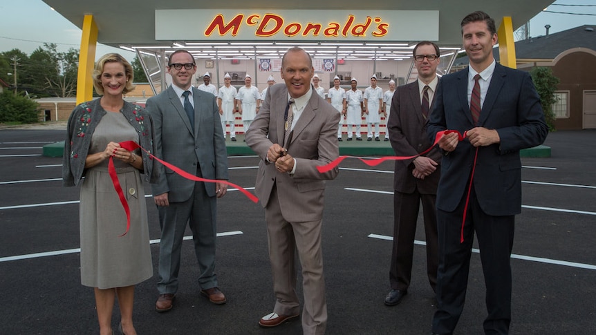 Ray Kroc, played by Michael Keaton, cuts a ribbon in a scene from The Founder.