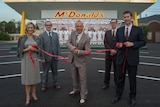 Ray Kroc, played by Michael Keaton, cuts a ribbon in a scene from The Founder.