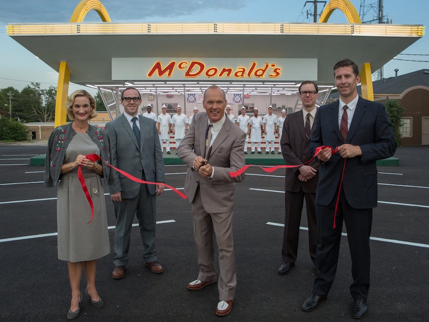 Ray Kroc, played by Michael Keaton, cuts a ribbon in a scene from The Founder.