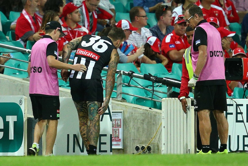 Collingwood's Dane Swan leaves the field injured against Sydney in round 1, 2016 at the SCG.