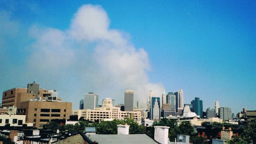 Smoke rises from Ground Zero on September 12, 2001, as seen from Brooklyn Heights.