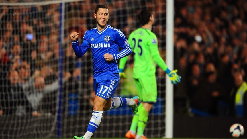 Chelsea's Eden Hazard scores a penalty against Spurs goalkeeper Hugo Lloris at Stamford Bridge.