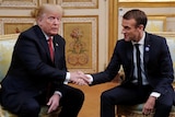 US President Donald Trump (left) shakes hands with French President Emmanuel Macron