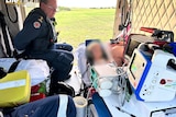 a young girl is treated in a lifeflight ambulance by a paramedic
