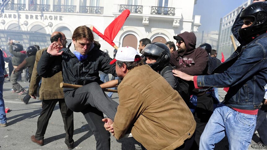 Pro-communist union protesters clash with other demonstrators in Athens.