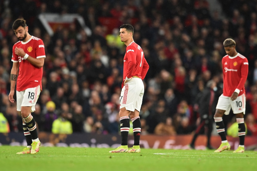 Bruno Fernandes, Cristiano Ronaldo and Marcus Rashford look disappointed on the pitch