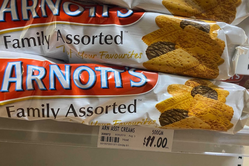 An image of Arnotts biscuits on a supermarket shelf selling for $11 per packet.