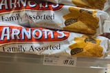 An image of Arnotts biscuits on a supermarket shelf selling for $11 per packet.