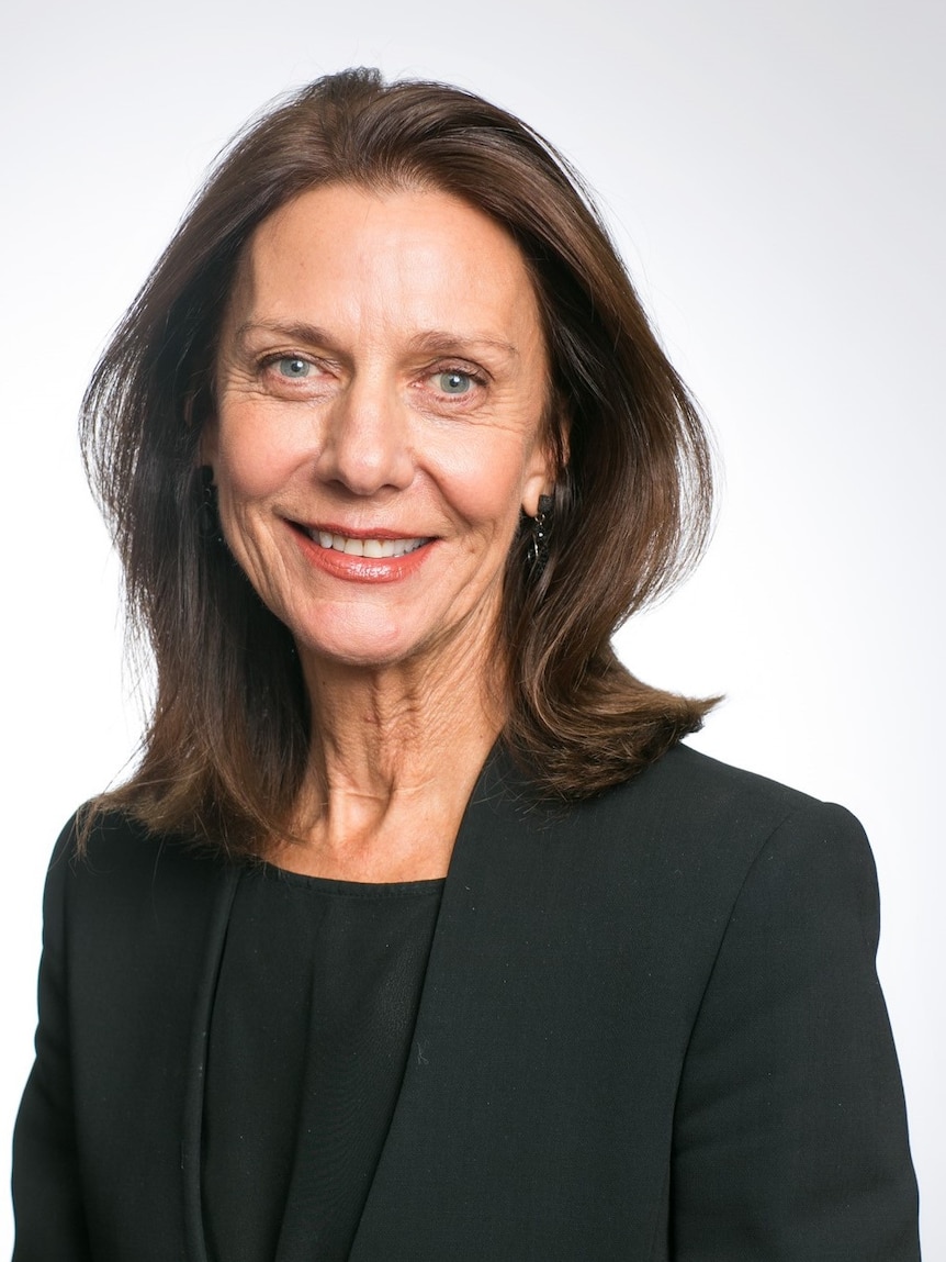 Sue Morphet smiles at the camera, wearing a black blazer.