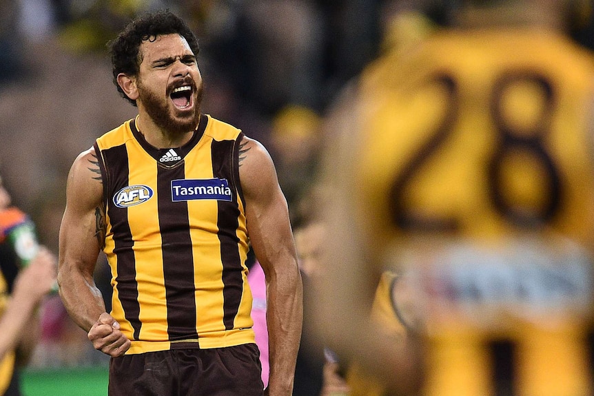 Cyril Rioli celebrates a goal for Hawthorn against Richmond