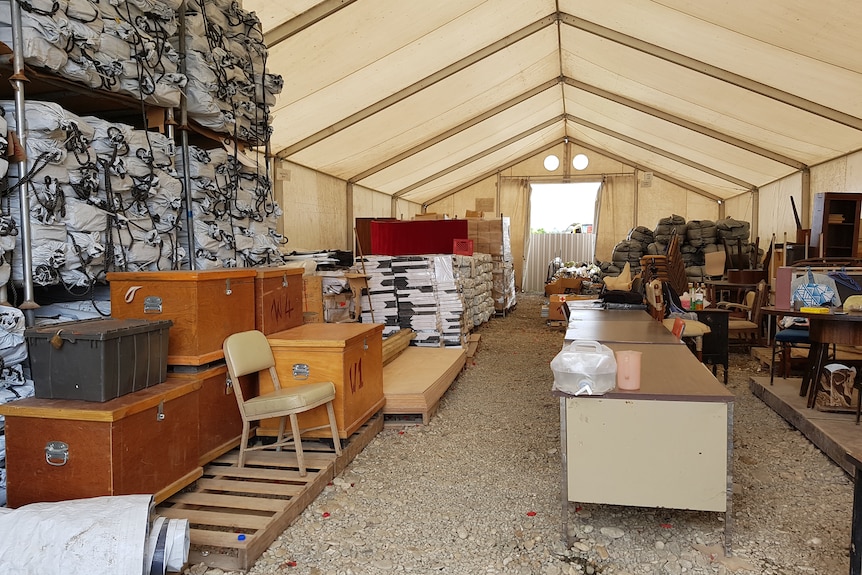 Donated furniture sits in a make-shift warehouse in Fiji.