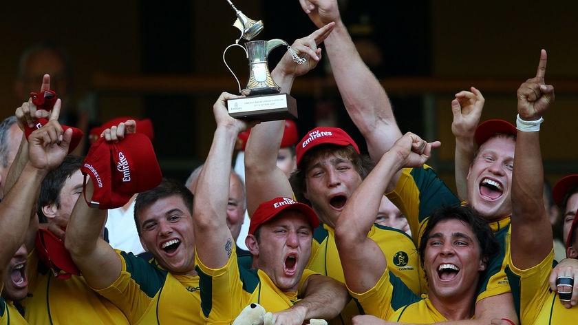 Victorious: James Stannard (c) hoists the trophy after his team beat South Africa.