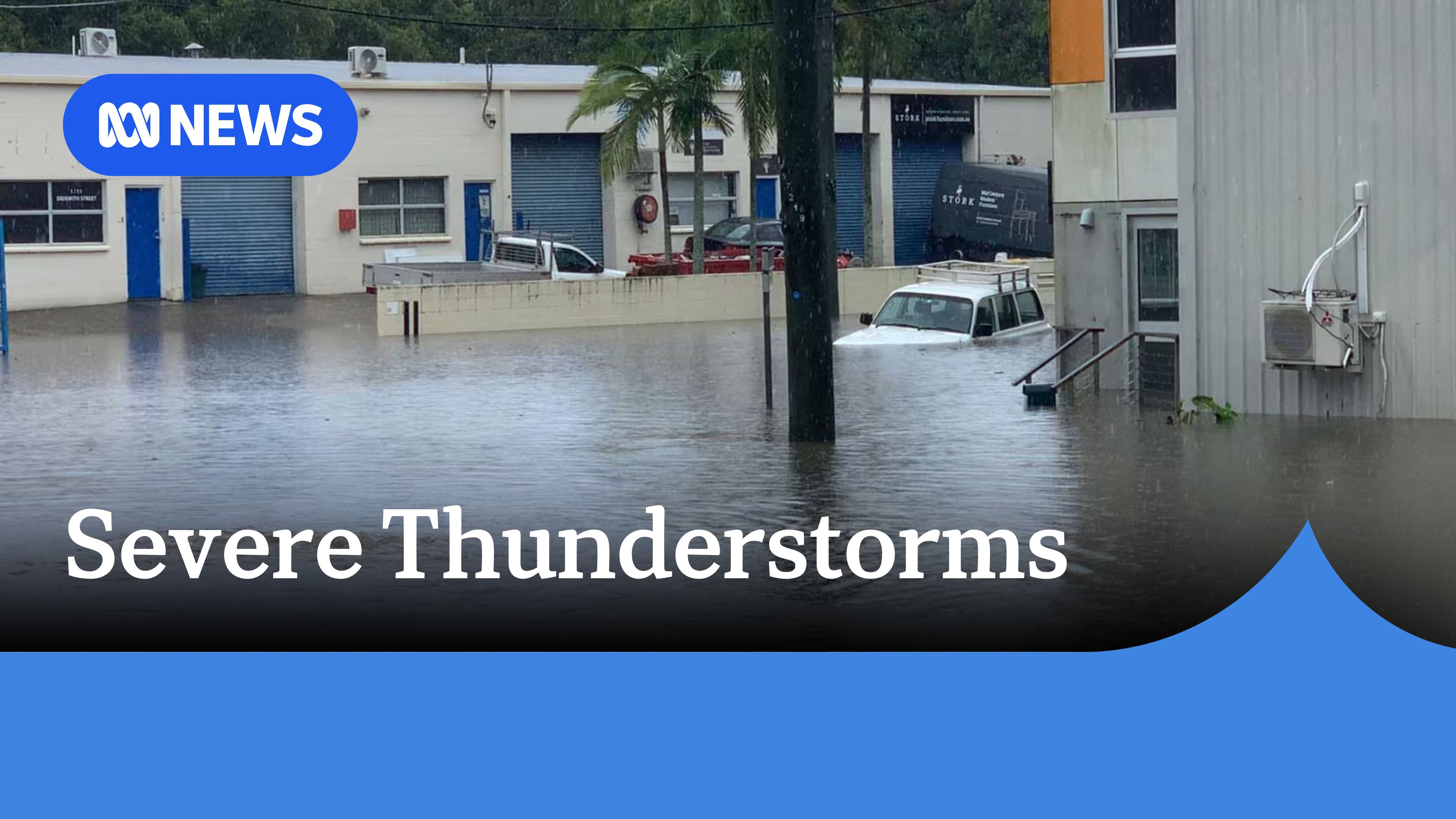 Severe Thunderstorms: A flooded street with a car with floodwater up to it's windows.