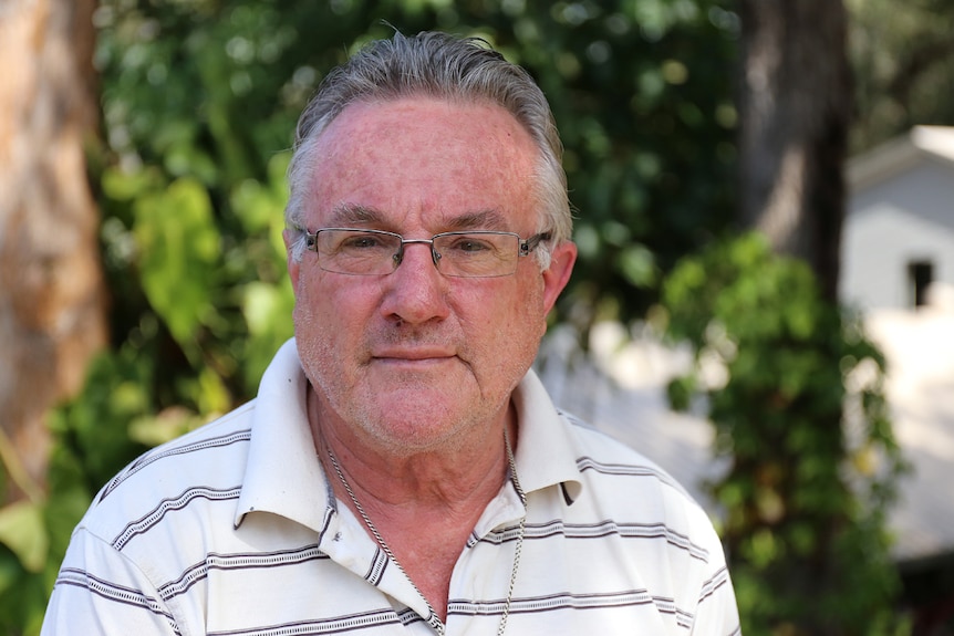 Head and shoulders photo of an older man.