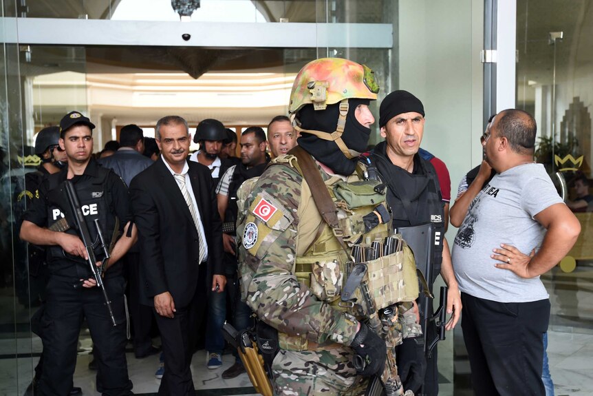 Tunisian security forces stand in front of Tunisia's Imperial Marhaba hotel