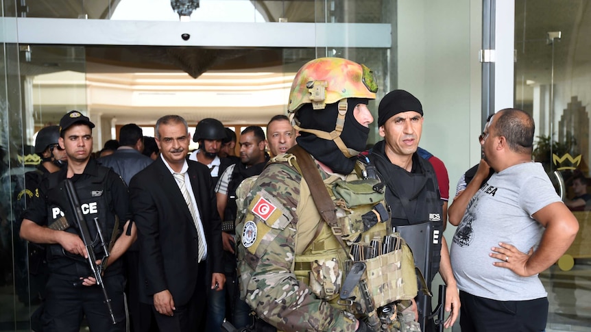 Tunisian security forces stand in front of the Imperial hotel in the resort town of Sousse, Tunisia