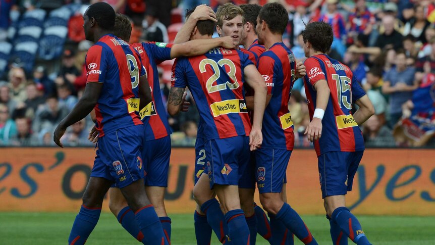 Newcastle Jets celebrate their first goal by Ryan Griffiths against Sydney FC at Hunter Stadium.