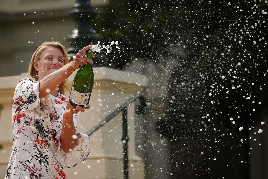 Kerber celebrates Australian Open win with champagne