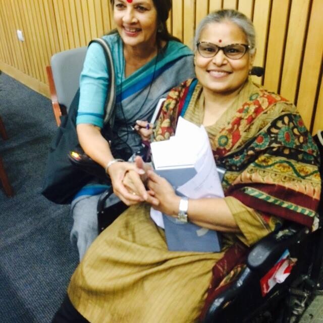 Anita Ghai sits in a wheel chair.