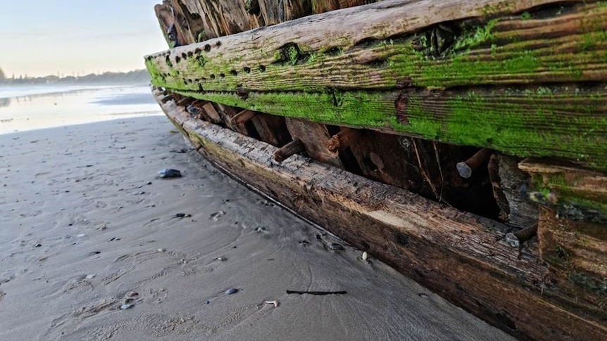A shipwreck with a missing plank.