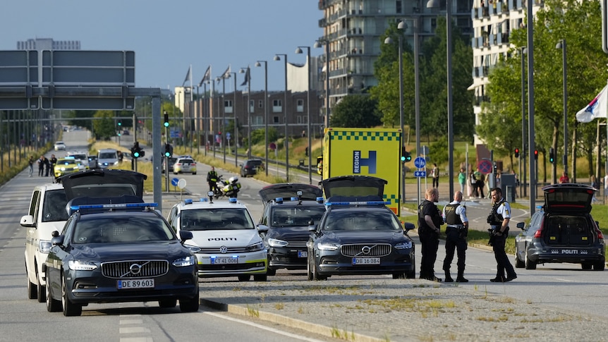 Police officers gather outside Fields shopping center,