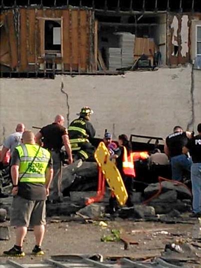 Emergency services at the scene where a car was crushed under a cement wall in Quapaw, Oklahoma.
