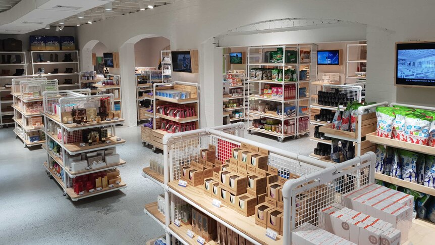 Inside an AuMake daigou store in Australia, with shelves packed with Australian goods.